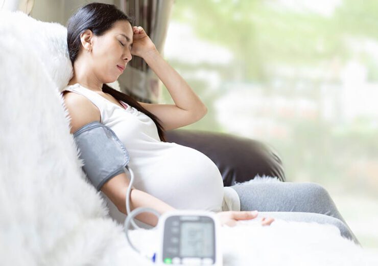 Asian pregnant woman is monitor blood pressure while she has hea